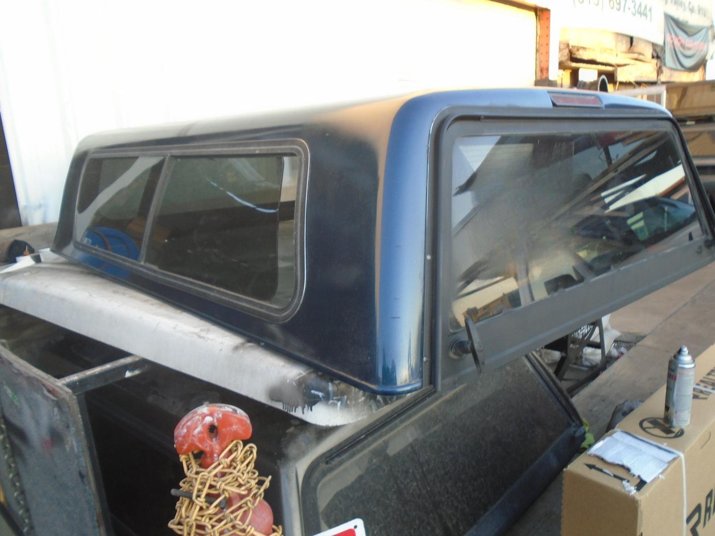 1995-2004, DAKOTA Short Bed. Camper Shell It has Front Solid Window - /